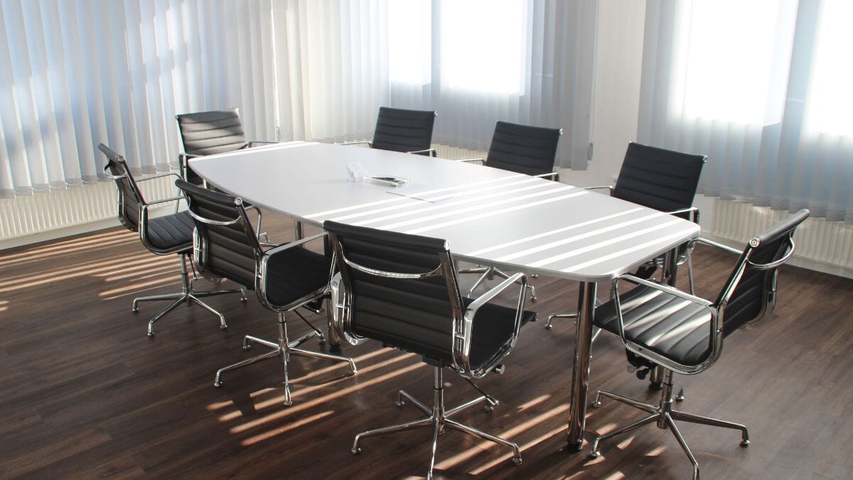 Used conference tables arranged in a professional office meeting room before Mother’s Day business events